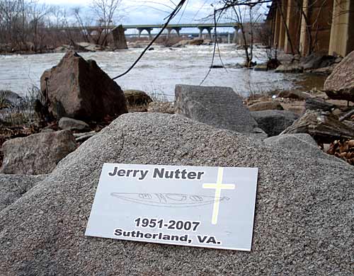 This plaque was placed near the spot on a sandy beach below Pipeline Rapids where David Nutter pulled his father Jerry A. Nutter out of the water.