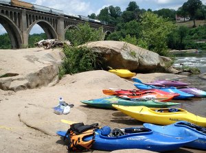 Kayakers stop at the Choo Choo Rapids just below the James River Railway Bridge