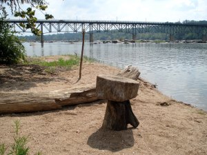 Crude log table on a sandy island west of the Boulevard Bridge